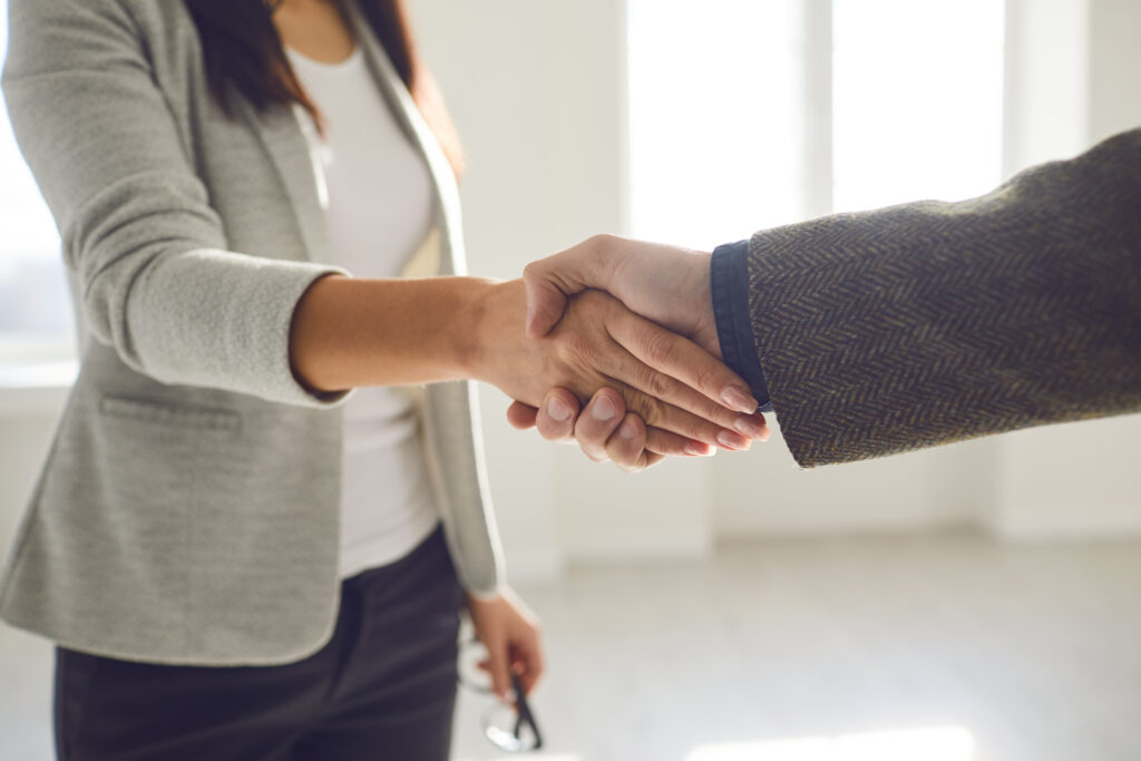 Handshake of businesspeople. Female and male hand makes a handshake in the office. The conclusion of the contract by business people to fix their website mistakes